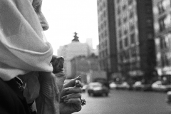 Woman crossing 110th St., NYC